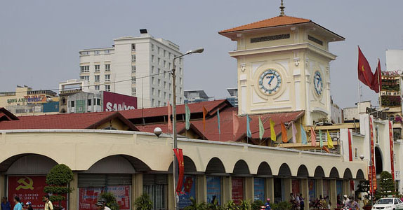Iconic clock tower and colonnades of Ben Thanh Market